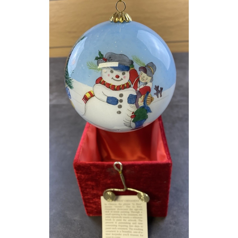 The "LI BIEN" 1999 Christmas Tree Snowman Scene Hand Painted Ornament w/ Box